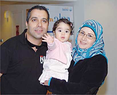 رباب مع زوجها وابنتهما تالا 