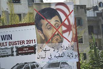 ملصق في طرابلس يرفض زيارة الرئيس الإيراني إلى لبنان 		(رويترز)