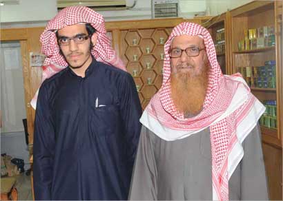 مع ابنه اسامة