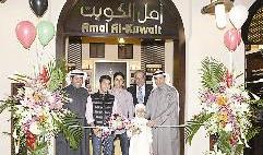 أثناء قص شريط الافتتاح 	(تصوير زكريا عطية)