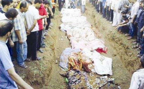 دفن عدد من ضحايا بلدة جديدة عرطوز في ريف دمشق	 (أ ب)