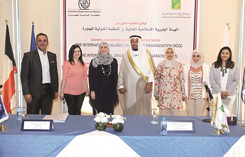 المعتوق وعريقات يتوسطان موظفات المنظمة الدولية للهجرة