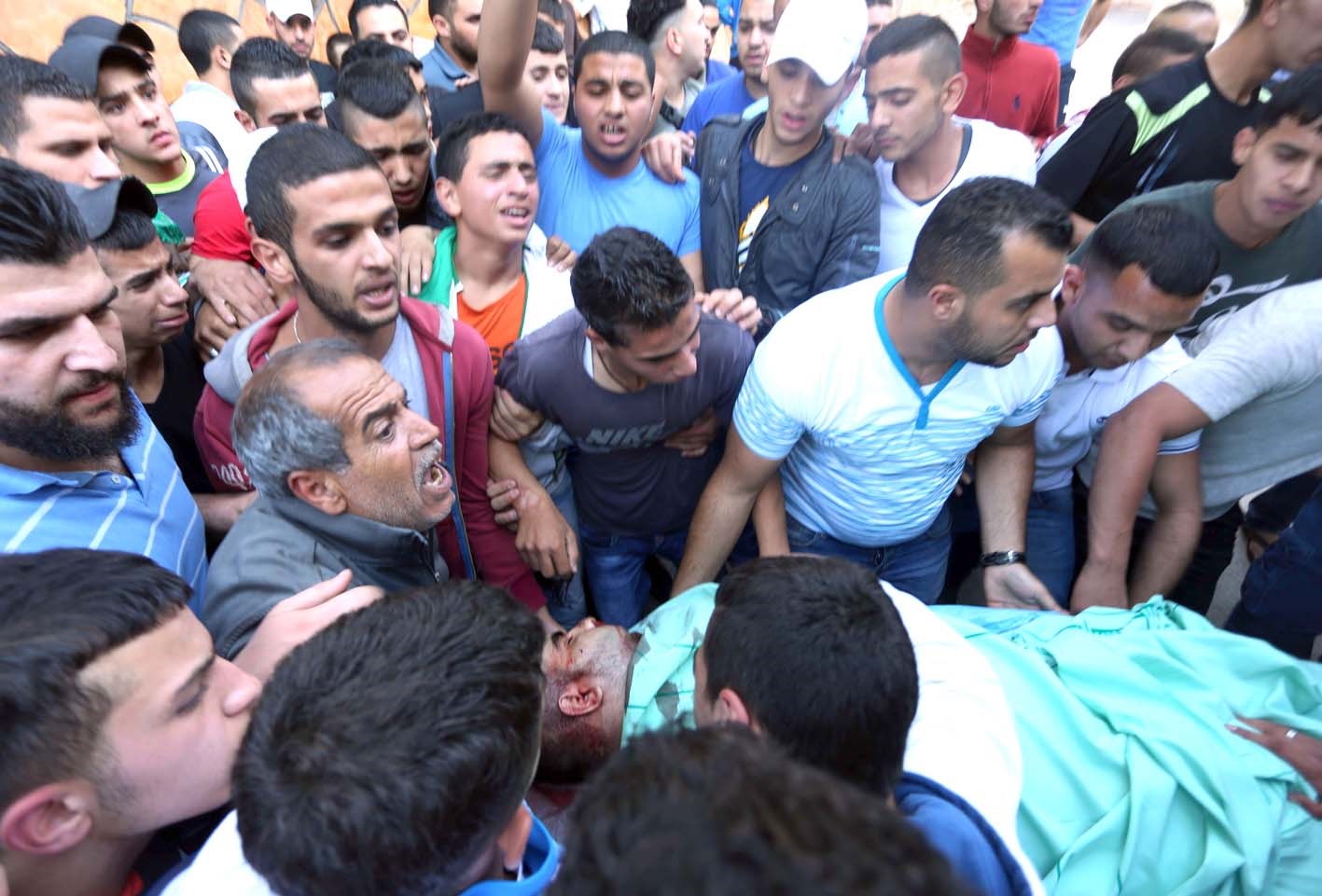 u0641u0644u0633u0637u064au0646u064au0648u0646 u064au062du0645u0644u0648u0646 u062cu062bu0645u0627u0646 u0645u062du0645u062f u0627u0644u0643u0633u0628u0629 u0627u0644u0630u064a u0642u062au0644 u0628u0631u0635u0627u0635 u0625u0633u0631u0627u0626u064au0644u064a u0642u0631u0628 u0631u0627u0645 u0627u0644u0644u0647 ( u0627 u0641 u0628)