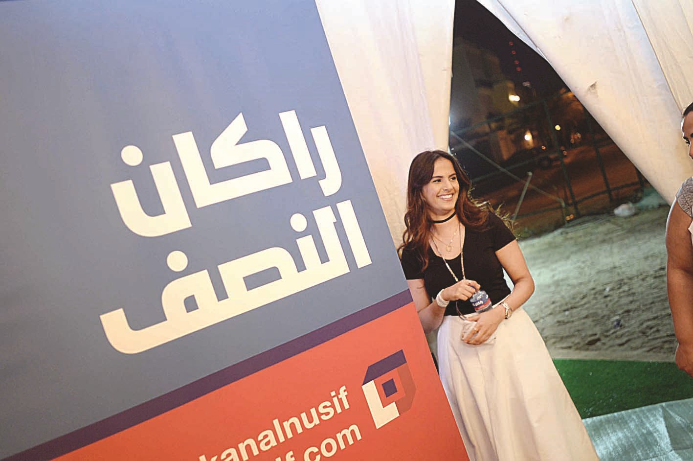 عضوة في اللجنة النسائية لحملة النصف