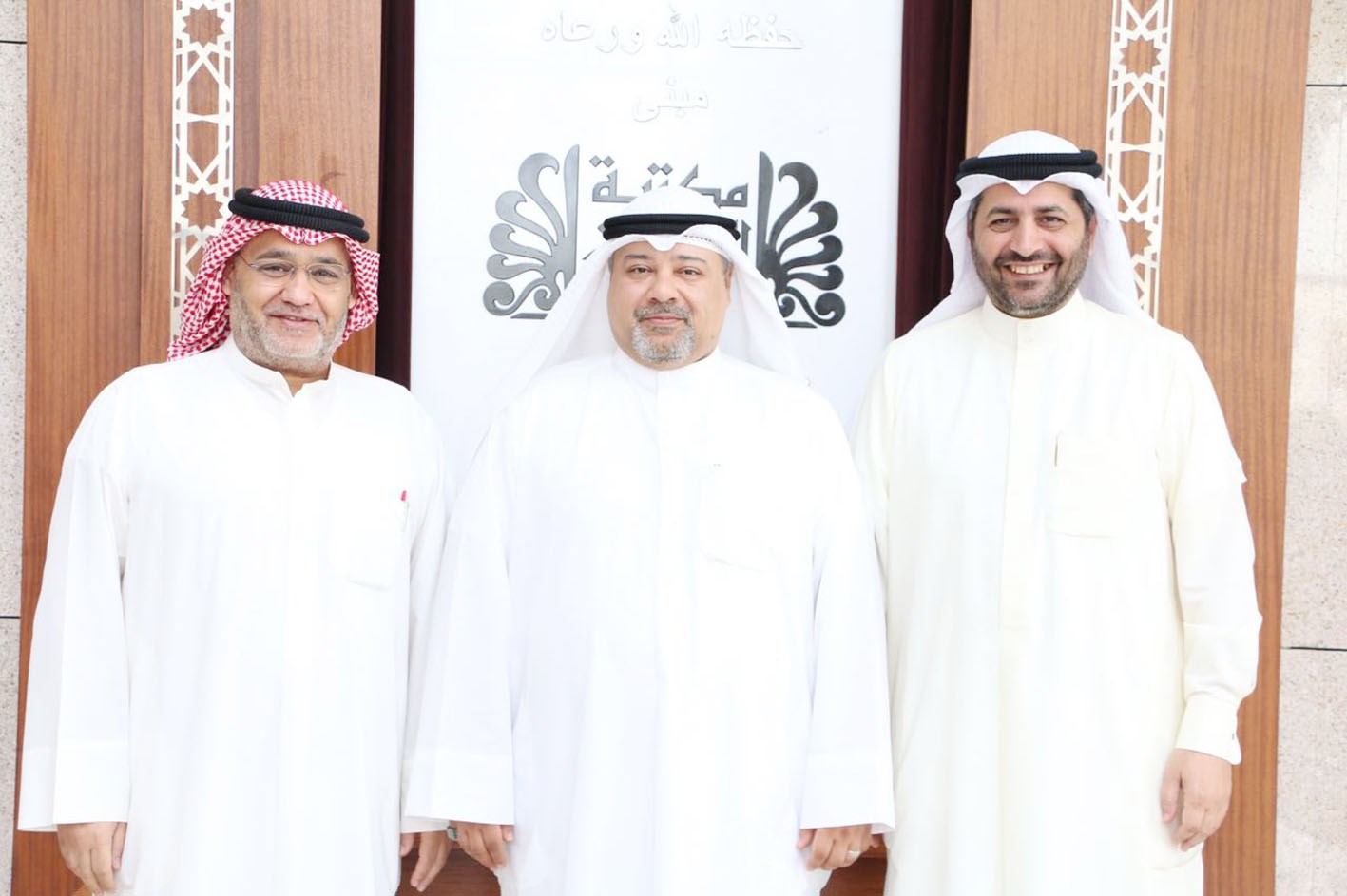 خالد مهدي متوسطاً حسن كاظم وطلال الشمري