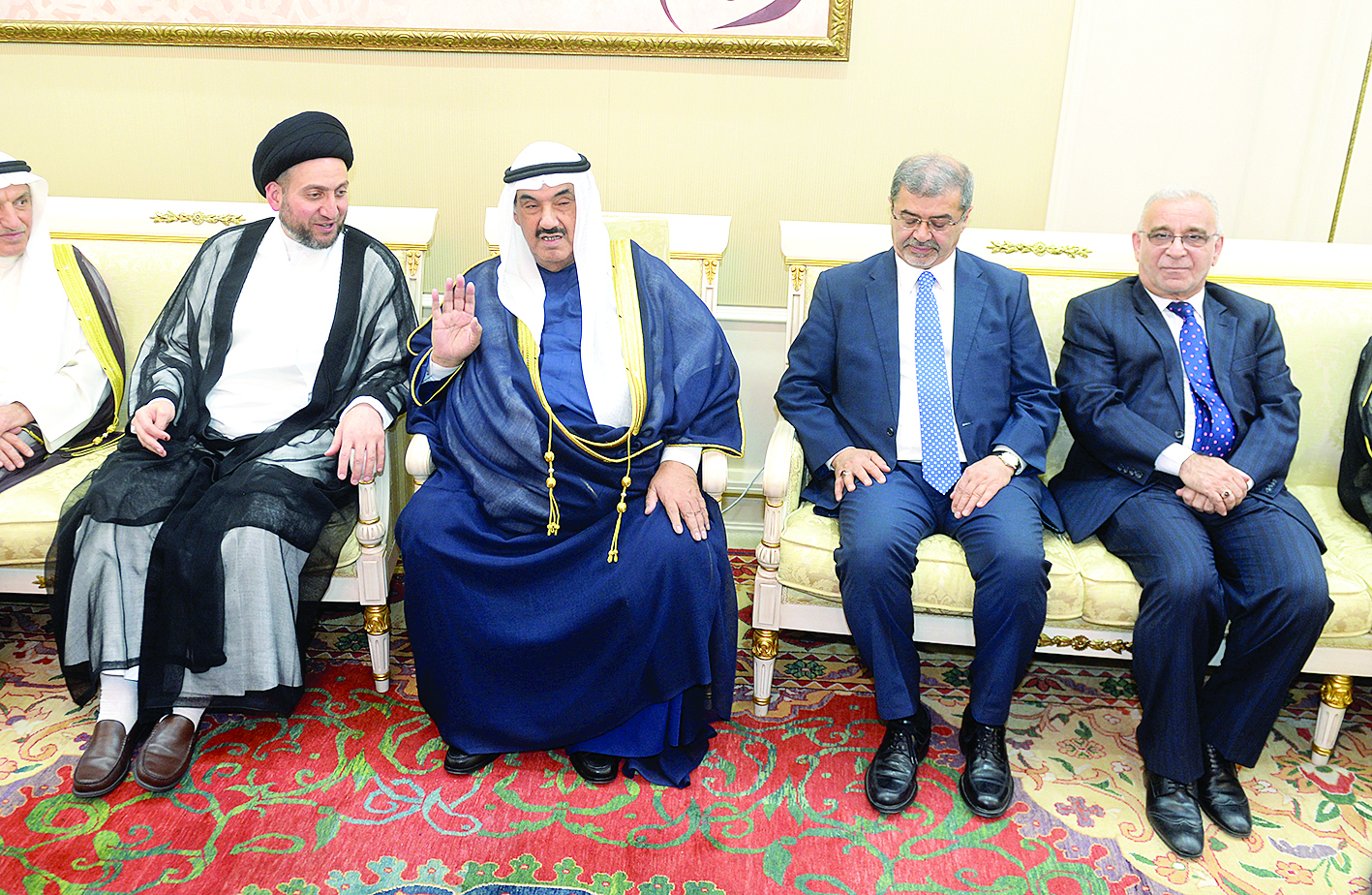 ناصر المحمد وعمار الحكيم والسفير العراقي علاء الهاشمي 	