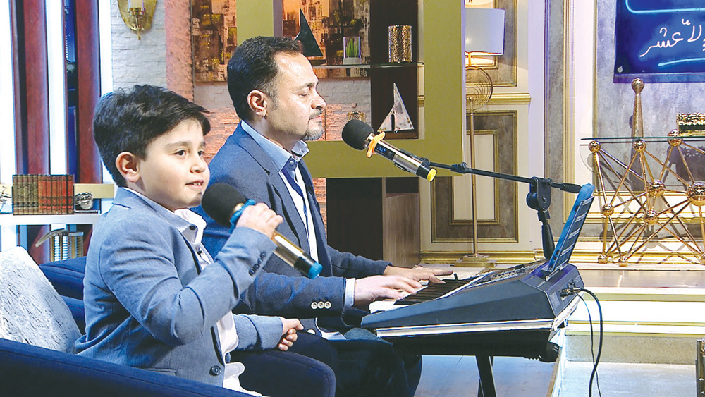 الطفل عبدالله ووالده ياسر جاسم