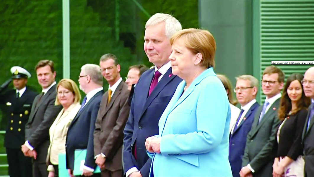 المستشارة الألمانية أثناء تكرار الحالة للمرة الثالثة أول من أمس 