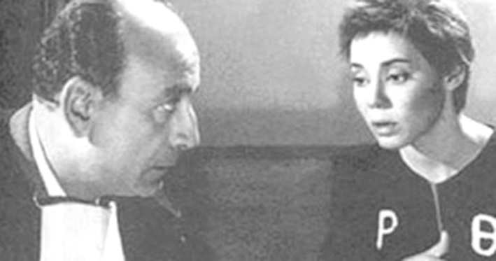 ... ومع محمود المليجي في مشهد من فيلم «جميلة»