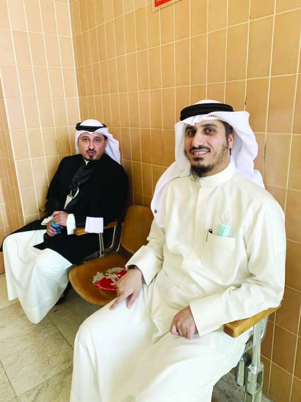 الداهوم وأحد محاميه في المحكمة أمس