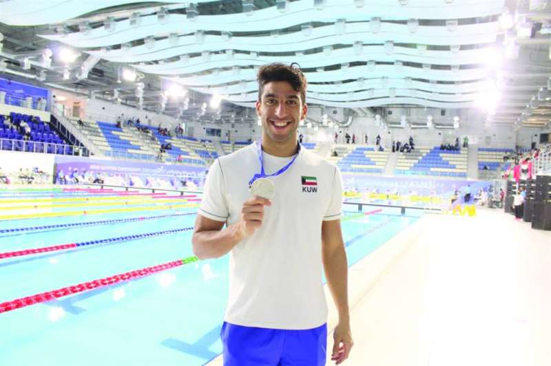 السباح وليد عبدالرزاق (كونا)