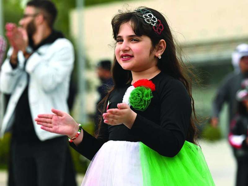 طفلة... بألوان علم الكويت
