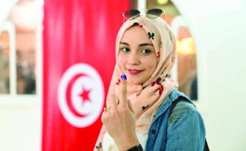 تونسية عقب الإدلاء بصوتها 	 (تصوير نايف العقلة)