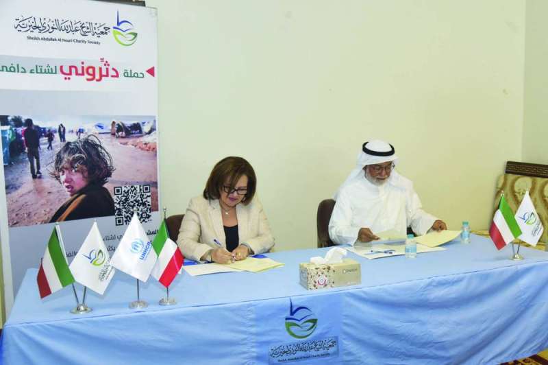 


جمال النوري ونسرين ربيعان خلال توقيع الاتفاقية 