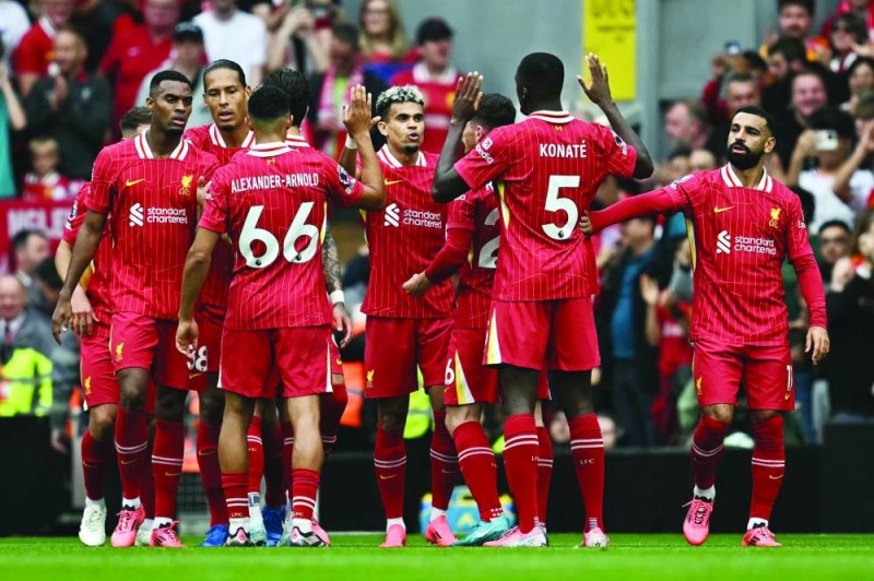 لاعبو ليفربول يحتفلون بأحد أهدافهم في مرمى بورنموث 	 (أ ف ب) 