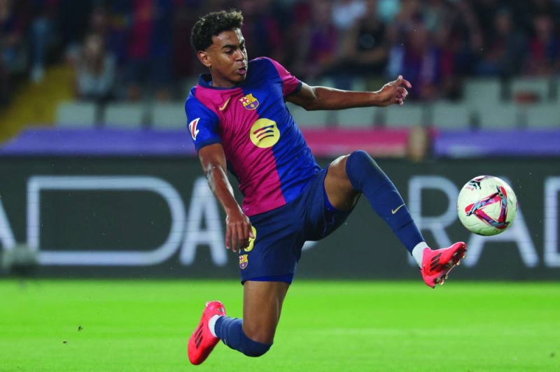 


نجم برشلونة الشاب يامين لامال خلال مباراة خيتافي	   (أ ف ب) 