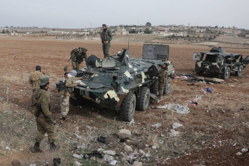 مقاتلون من المعارضة في ريف حمص (رويترز)