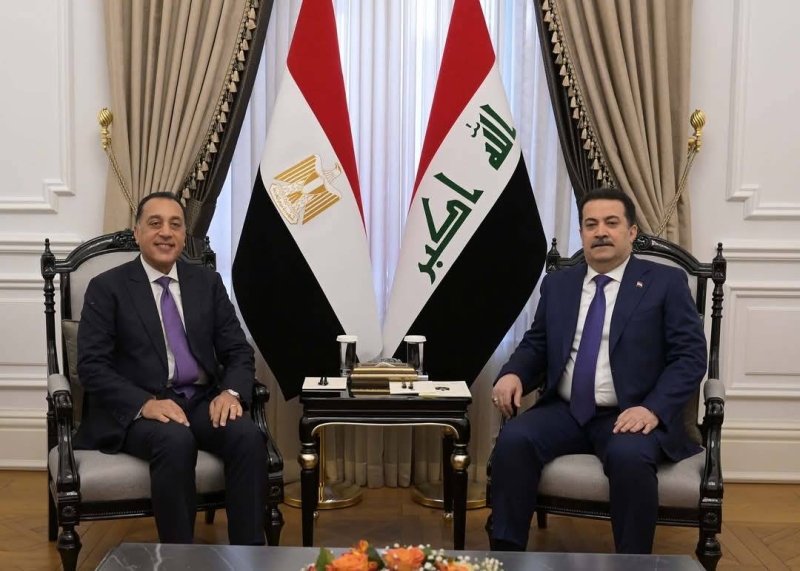 السوداني مستقبلاً مدبولي في بغداد أمس 