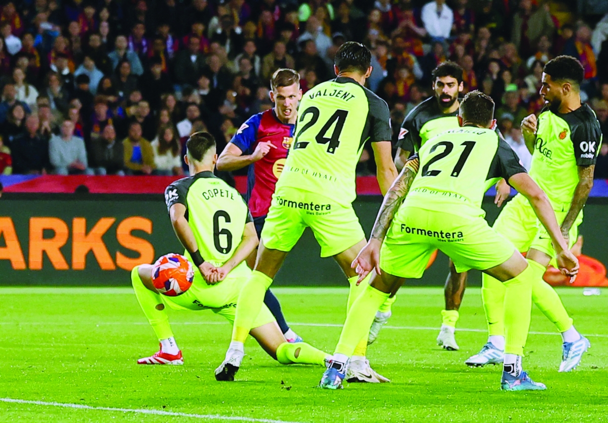 


داني أولمو مسجلاً هدفه في مرمى ريال مايوركا 	 (رويترز) 