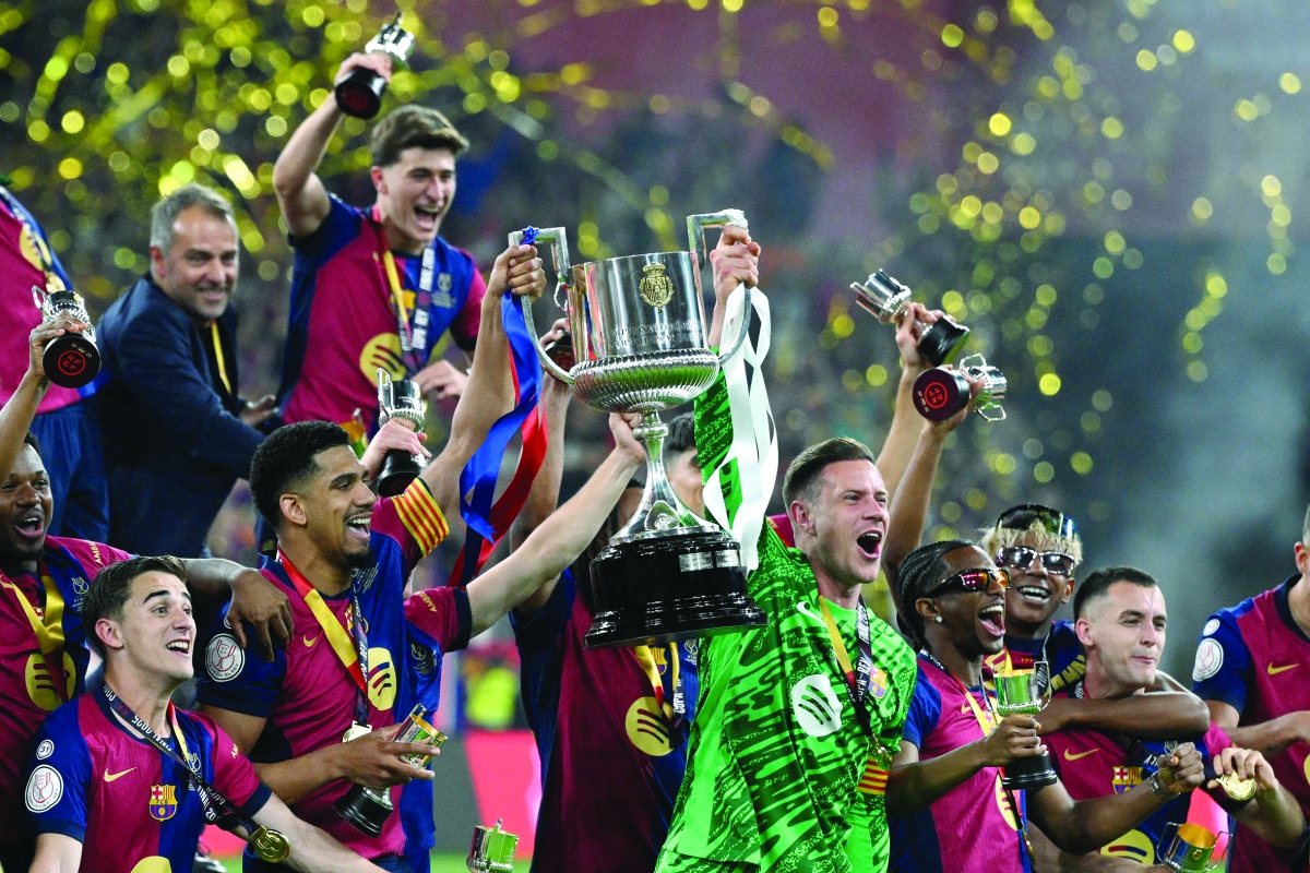 


لاعبو برشلونة متوجون بكأس إسبانيا	 (أ ف ب) 