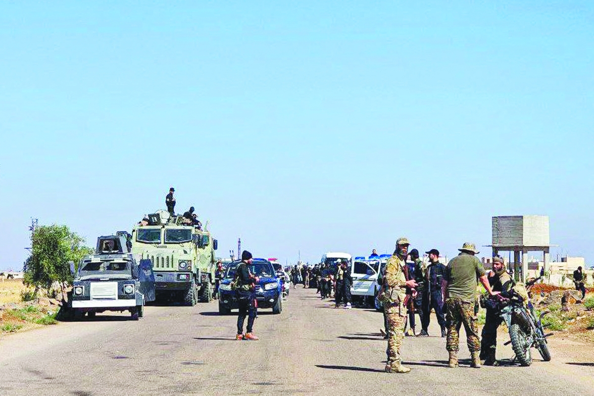 


قوات عسكرية وأمنية سورية في محافظة السويداء	 (أ ف ب) 