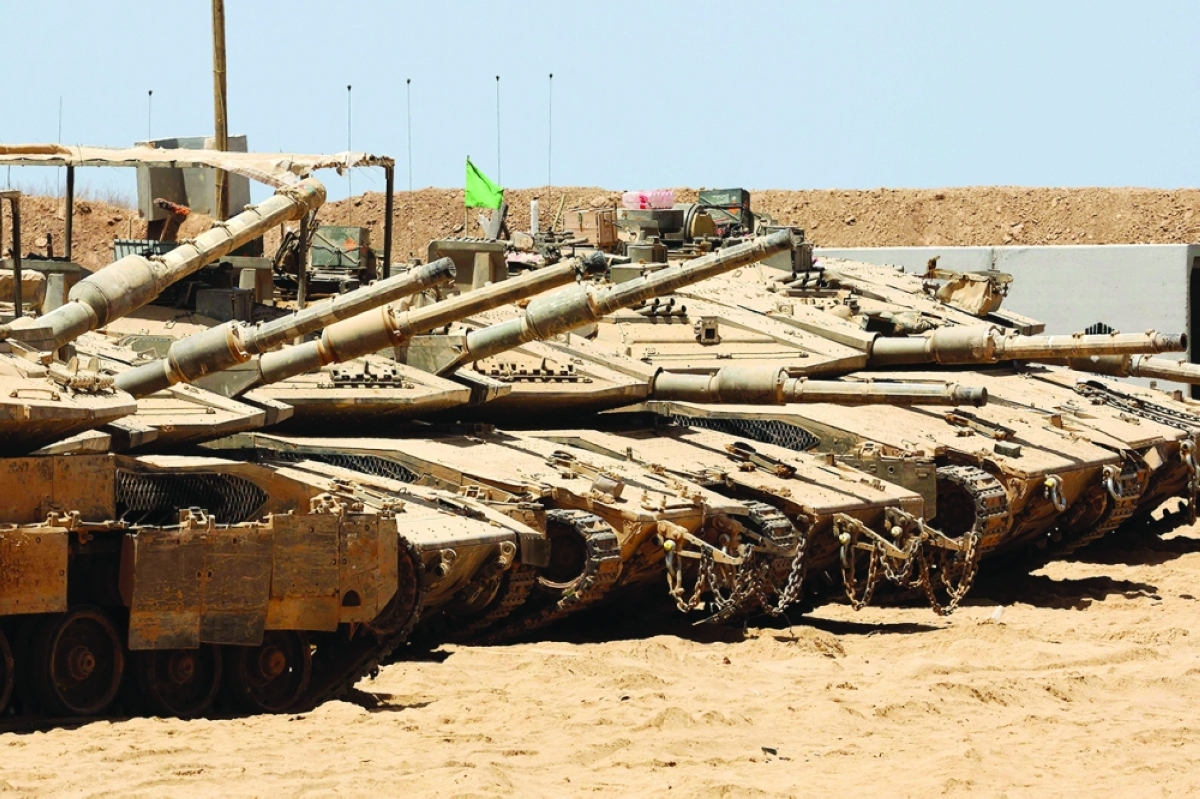 دبابات إسرائيلية في المنطقة الحدودية مع غزة 	 (أ ف ب) 