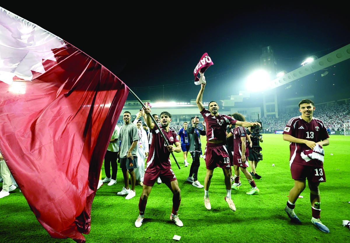 لاعبو قطر يحتفلون بالتأهل